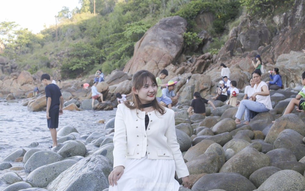 People flock to Queen’s Beach to capture the unique egg-shaped stones